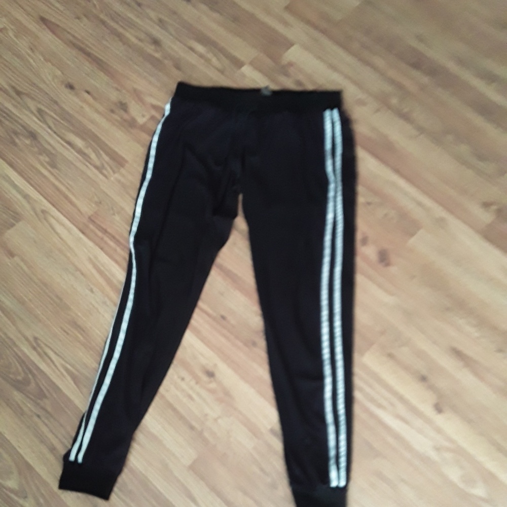 Black joggers with white stripes